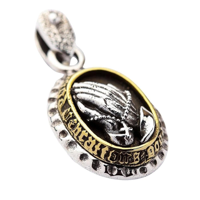 A sterling silver and brass pendant featuring Praying Hands on the front and Our Lady of Guadalupe on the back.