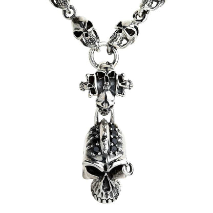 A gothic skull chain bracelet featuring a menacing central skull encrusted with black stones and a classic T-bar clasp.