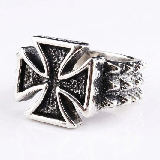 Close-up product shot of a silver punk-style biker ring featuring a prominent Iron Cross with textured oxidized details and a spiked thorn band, displayed on a clean white background.