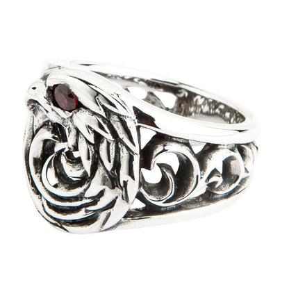 A unique tribal eagle ring in a dark, gothic style, with intricate, flame-like swirls carved in solid silver.