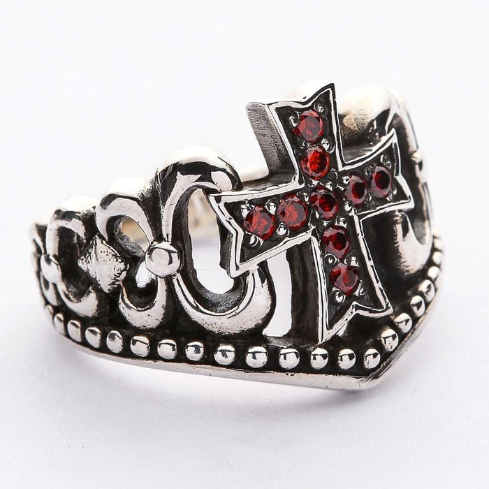 Macro shot highlighting the nine red garnet cubic zirconia stones arranged in a cross within the blackened silver setting.