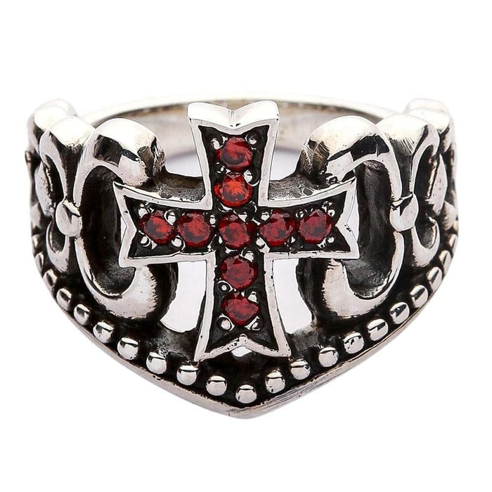 Studio isolation of the oxidized silver ring displaying the red stone cross, scrollwork, and beaded bottom edge.