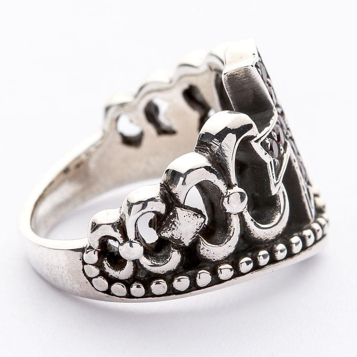 Side profile of the oxidized silver ring revealing the raised cross setting and intricate beaded edge along the band.