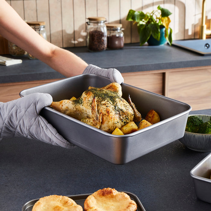 Chicken and potatoes in a roasting tin