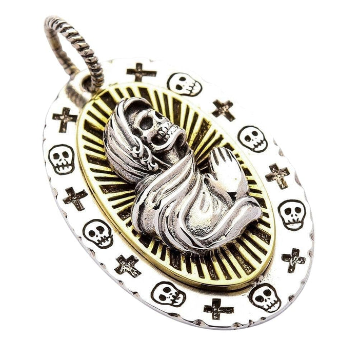 A direct front view of the Holy Death pendant, showing the intricate details of the praying skeleton and the radiant halo.