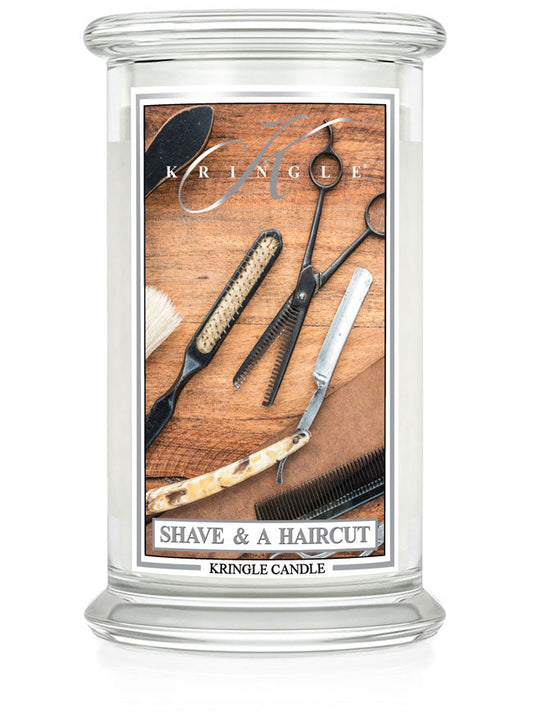 Kringle Candle with barber-themed design on a white background