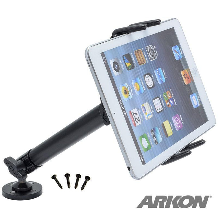 A midsize tablet is mounted on the Slim-Grip® Ultra Heavy-Duty Drilled-Base Midsize Tablet Mount with a black base and four nearby screws. The ARKON logo appears in the bottom right corner.