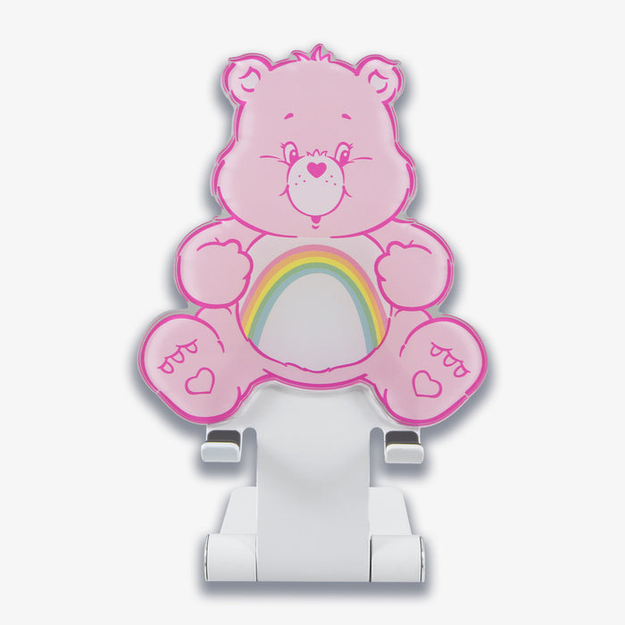 Front view of Sonix x Care Bears Cheer Bear phone stand showing pink bear face and rainbow belly on a white foldable stand