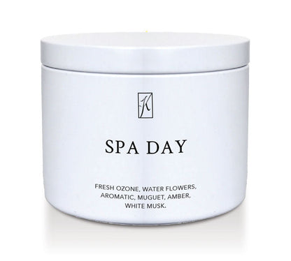 Candle in a white container labeled 'SPA DAY' with a logo on a white background