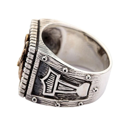 A detailed side view of the anchor ring, showing the finely carved Thor's Hammer (Mjolnir) emblem on the shank.