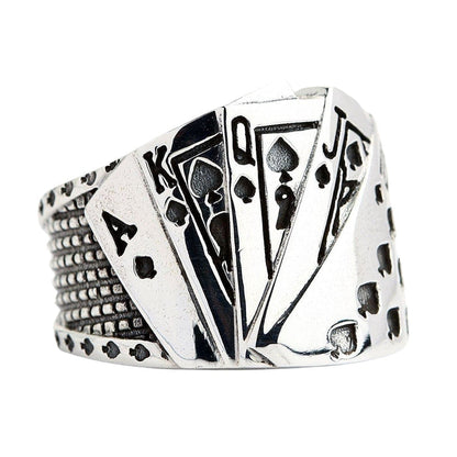 A side profile of the poker hand ring, highlighting the unique biker tire tread pattern on the band.