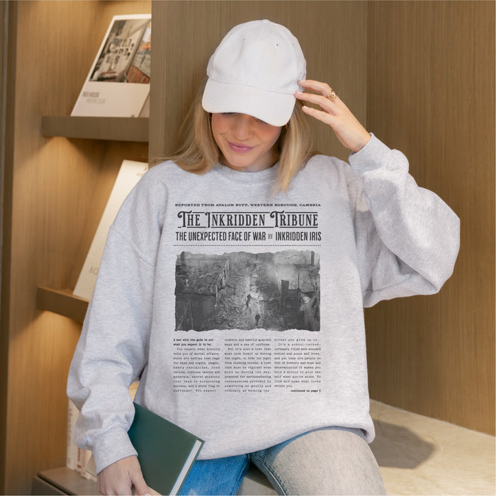 The Inkridden Tribune The Unexpected Face of War Sweatshirt - The Bean Workshop - Bookish Clothing, Bookworm Apparel, Cozy Reader Gift, Dark Academia sweatshirt, Divine Rivals, Divine Rivals sweatshirt, Fantasy Book Merch, Inkridden Tribune apparel for readers, Iris Winnow, Letters of Enchantment, Letters of Enchantment merch, Literary Quote, Rebecca Ross, Rebecca Ross cozy sweater, Roman Kitt, sweatshirt, Vintage Newspaper