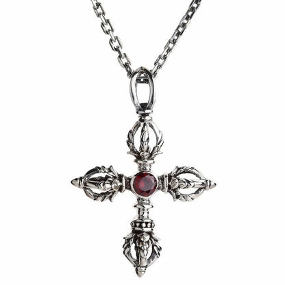 Double dorje sterling silver pendant on a cable chain with a ruby-red CZ stone at the center