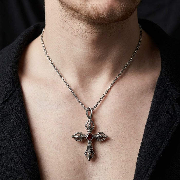 Male model wearing the silver Tibetan double dorje cross pendant with a red CZ stone on an open collar