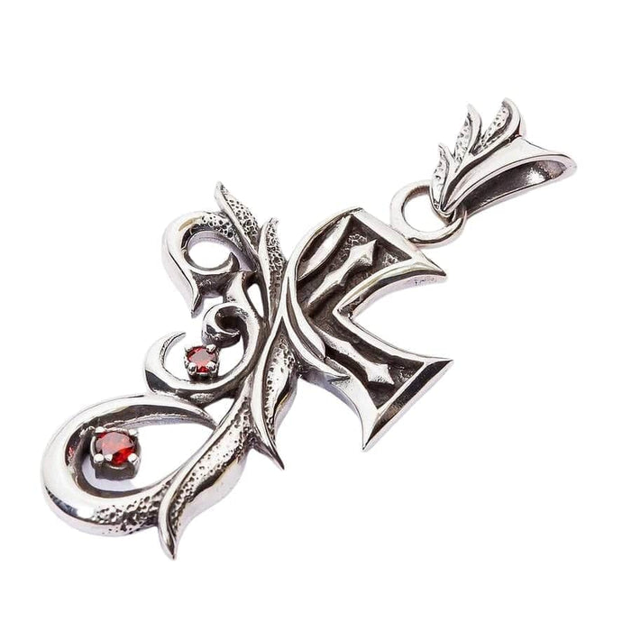 Side profile of the gothic tribal cross pendant highlighting the depth and bail loop.