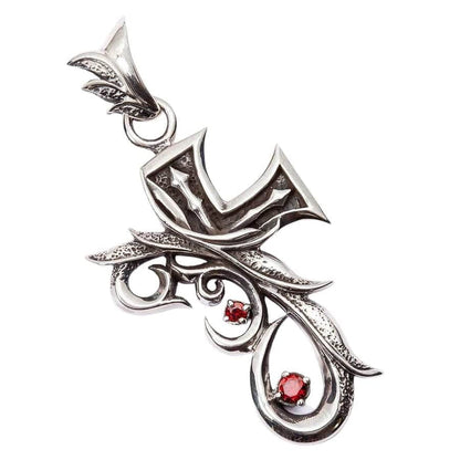 Close-up of the handcrafted silver cross, emphasizing the oxidized tribal patterns.