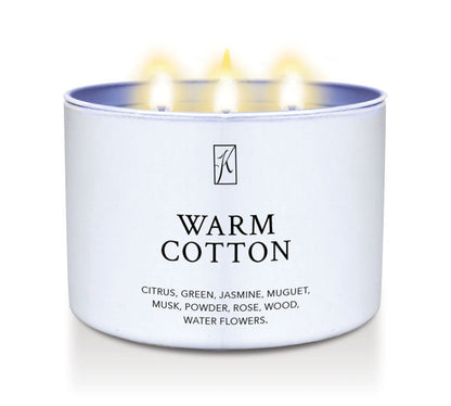 Candle in a white container labeled 'Warm Cotton' with a logo on a white background