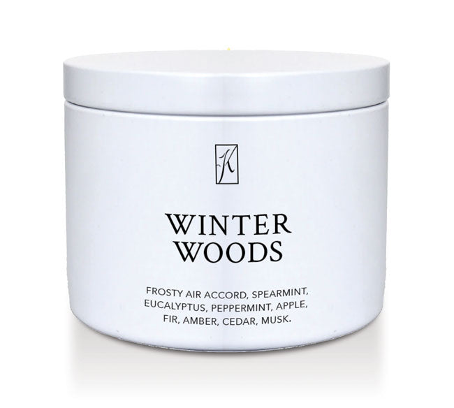 Jar of 'Winter Woods' candle with brand logo on a white background