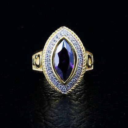 The women's statement bishop ring, showcasing its substantial size and the vibrant purple amethyst stone against a black background.
