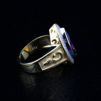 A side detail shot of the gold-plated sterling silver bishop ring, focusing on the handcrafted crosier emblem.