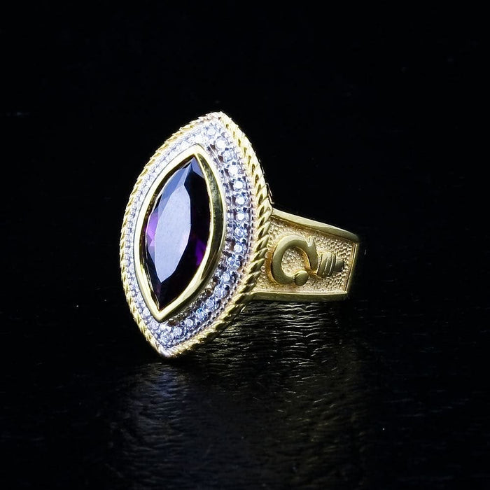 Handcrafted amethyst ecclesiastical ring, emphasizing the fine details of the gold plating and stone setting.