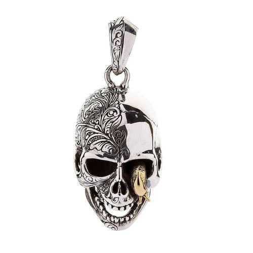 Front view of the handcrafted worm skull pendant showing the brass worm and polished silver finish.