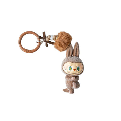 Plush keychain with a cute character on a white background